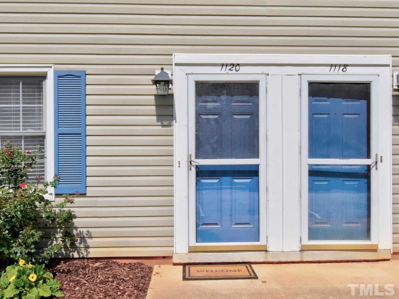 1120 Nottingham Circle Cary, NC 27511 - Photo 19 of 22 a view of front door and potted plants