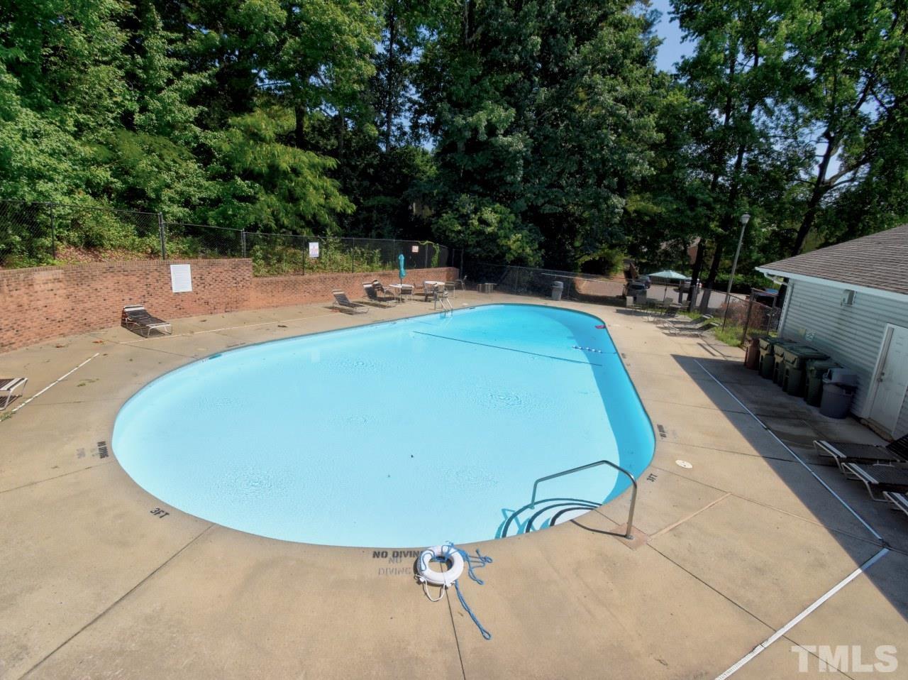 1120 Nottingham Circle Cary, NC 27511 - Photo 22 of 22 a view of a swimming pool with a patio