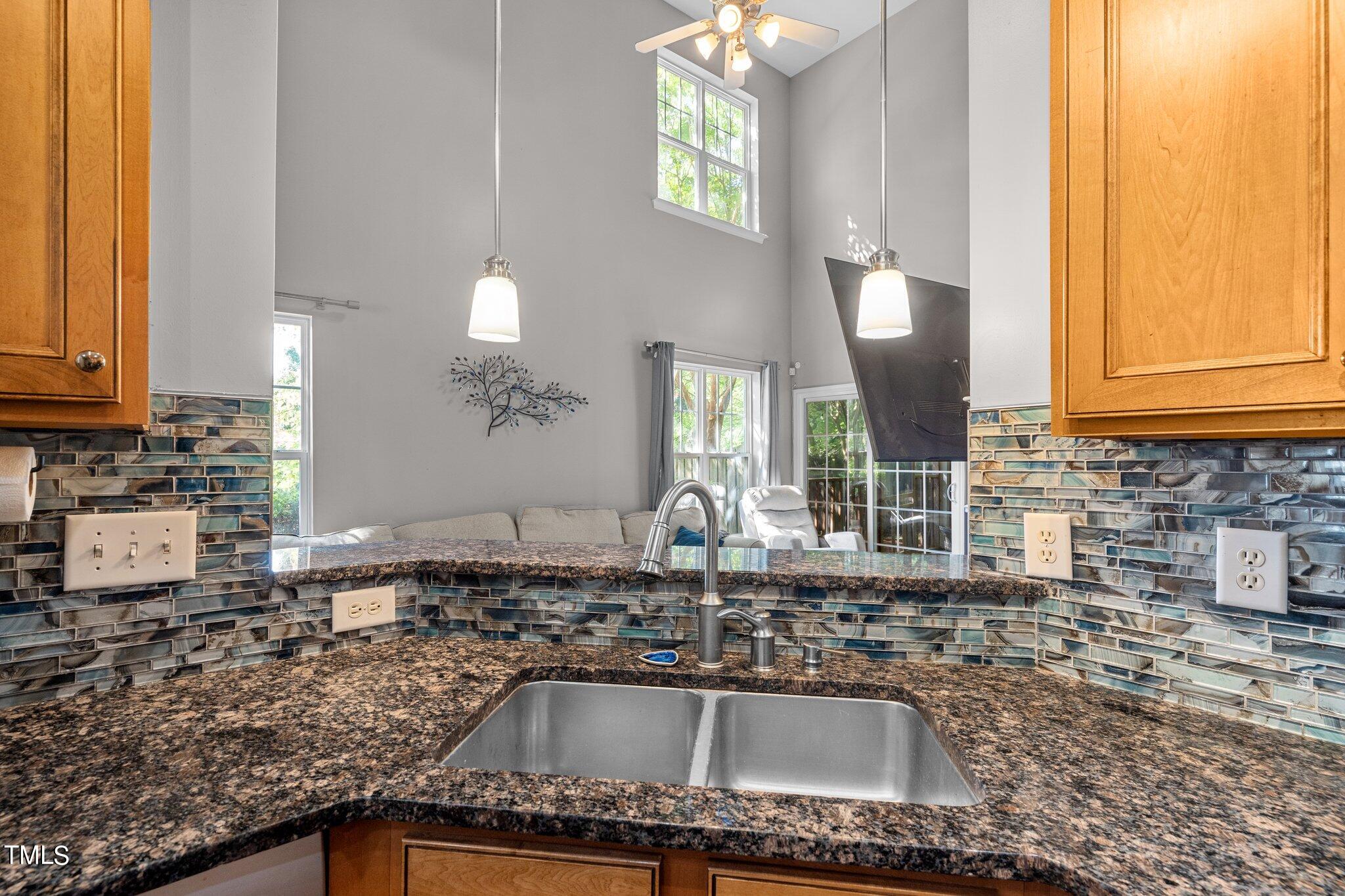 5016 Paperbark Court Durham, NC 27713 - Photo 11 of 35 a kitchen with granite countertop a sink and a stove