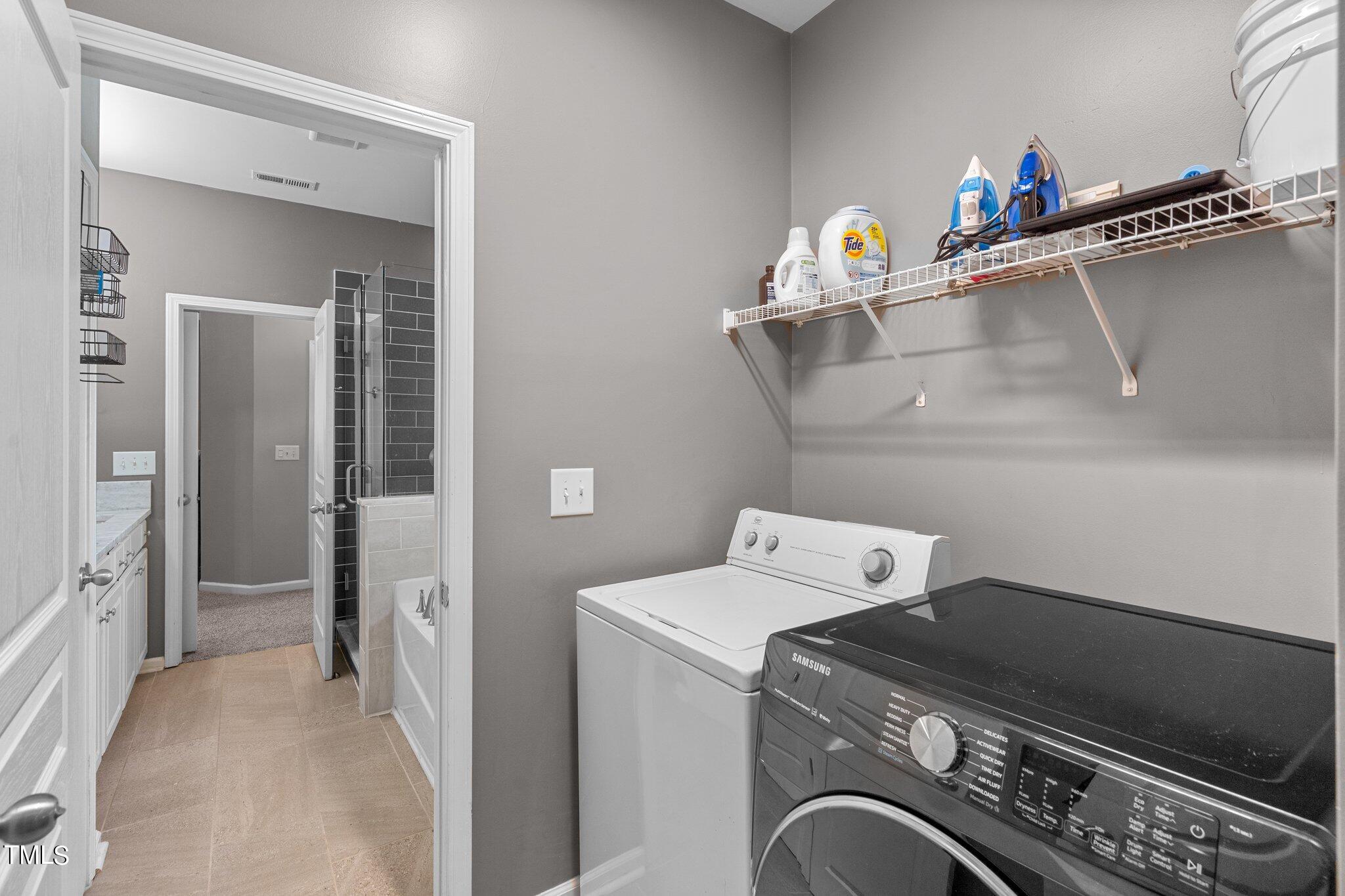 5016 Paperbark Court Durham, NC 27713 - Photo 13 of 35 a utility room with dryer and washer