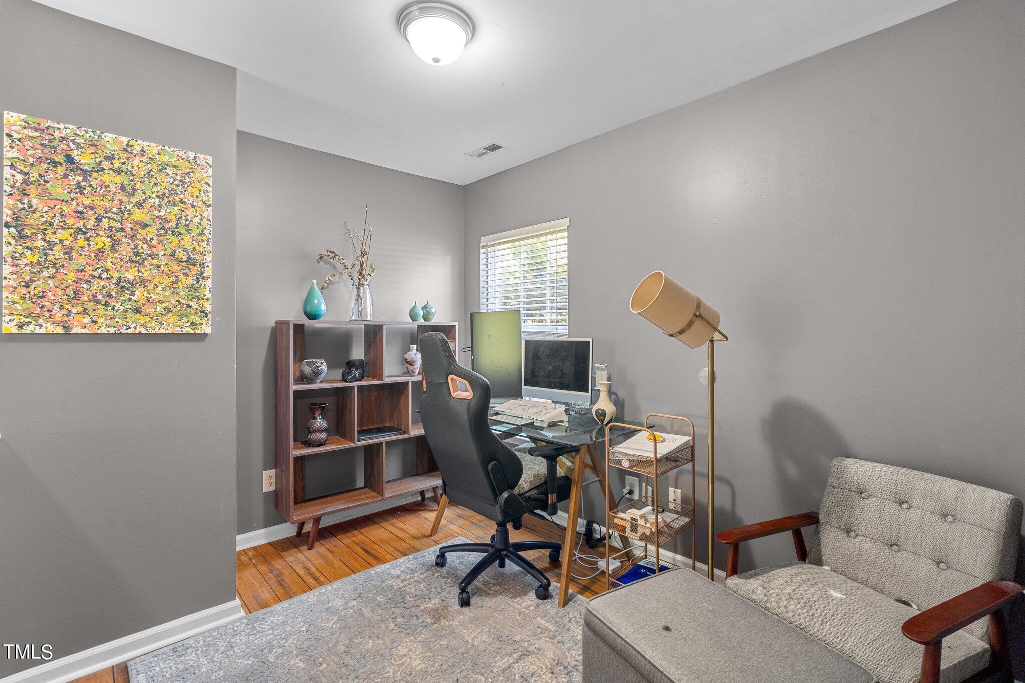 5016 Paperbark Court Durham, NC 27713 - Photo 20 of 35 a view of a workspace with furniture and a window