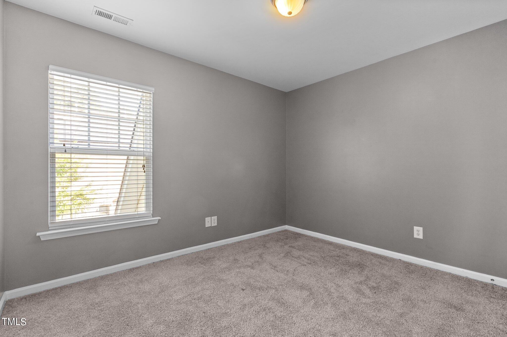 5016 Paperbark Court Durham, NC 27713 - Photo 23 of 35 an empty room with a window