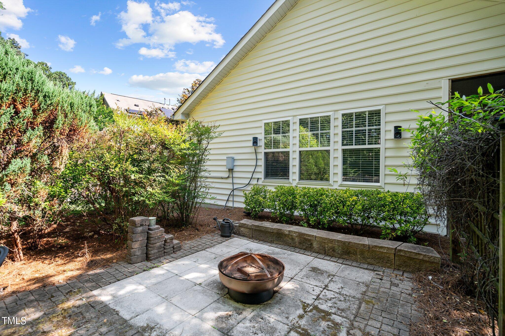 5016 Paperbark Court Durham, NC 27713 - Photo 29 of 35 a couple of potted plants in front of a house