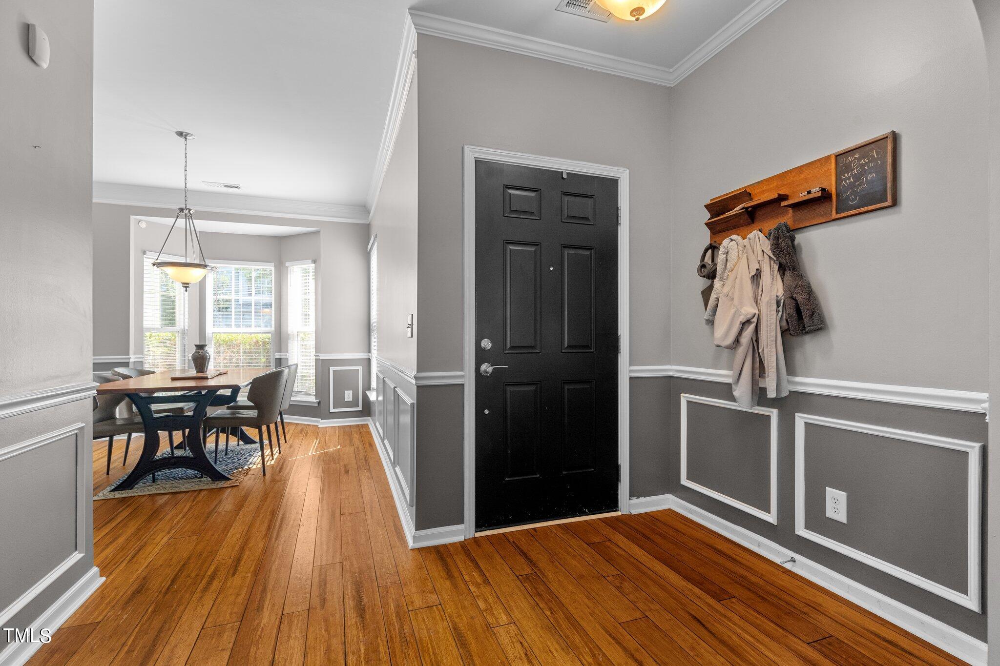 5016 Paperbark Court Durham, NC 27713 - Photo 3 of 35 a very nice looking room with wooden floor and furniture