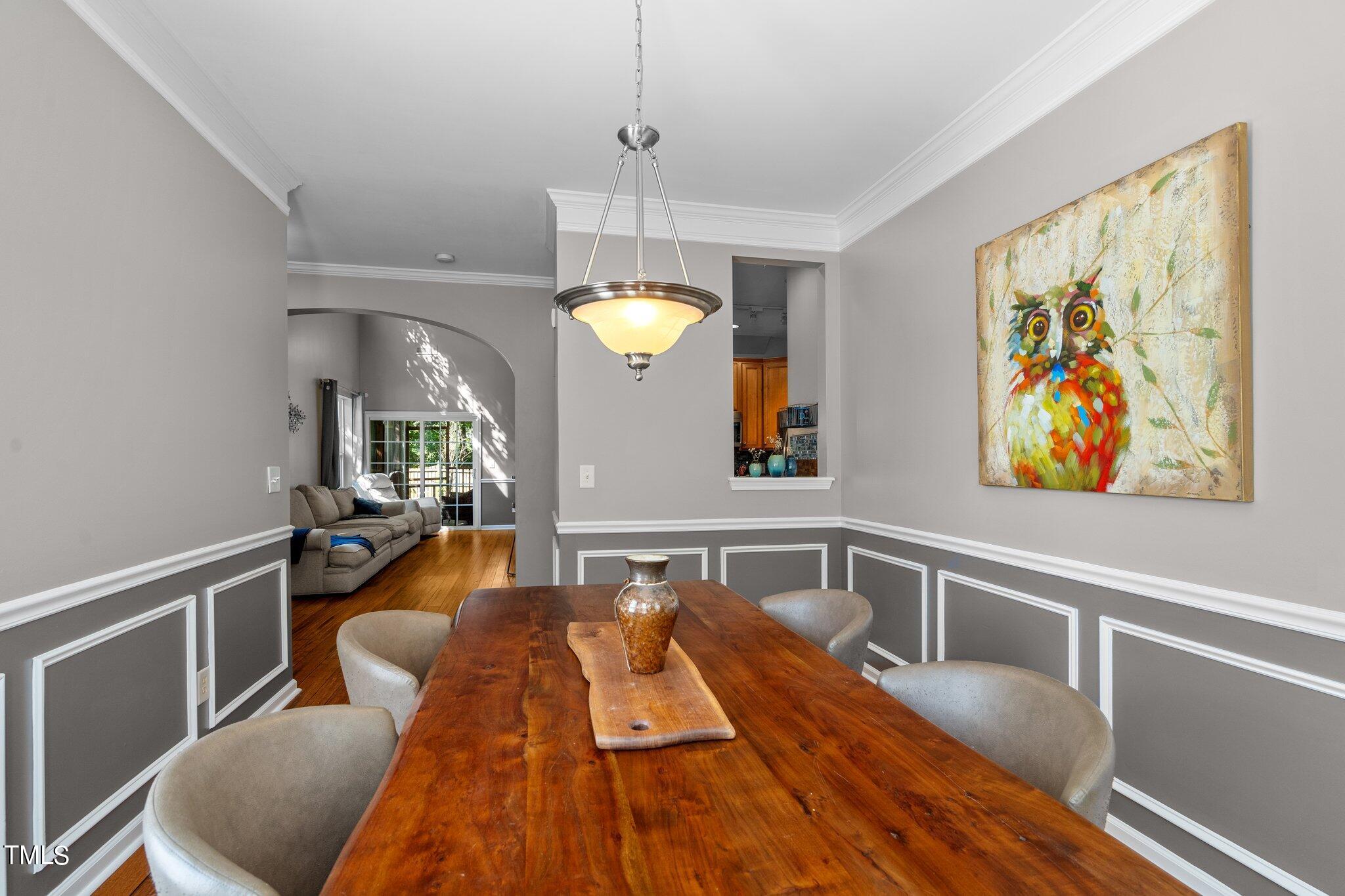 5016 Paperbark Court Durham, NC 27713 - Photo 5 of 35 a living room with furniture and a chandelier
