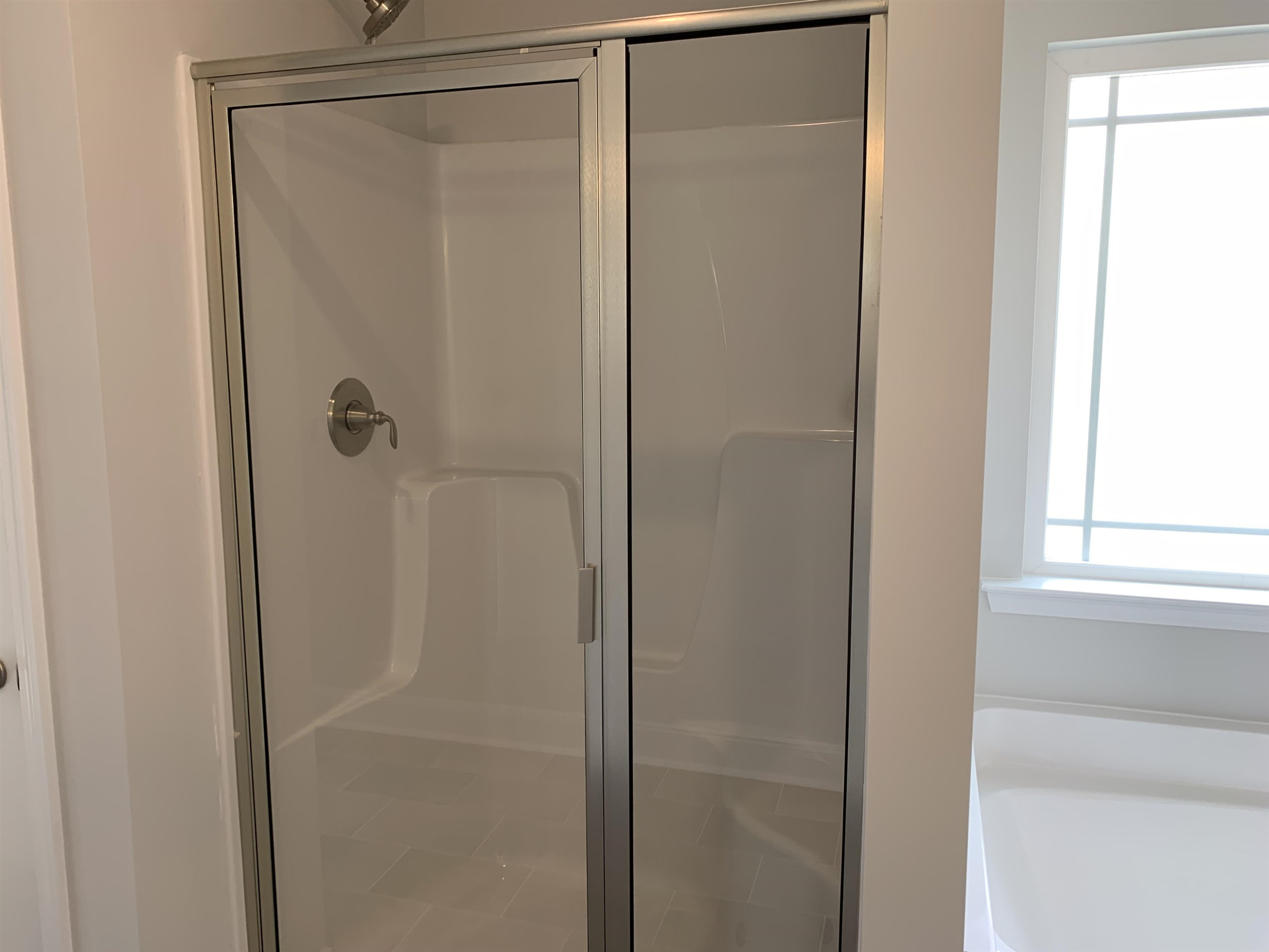 8433 Shallow Crk Trail Bailey, NC 27807 - Photo 14 of 17 a bathroom with a glass shower door