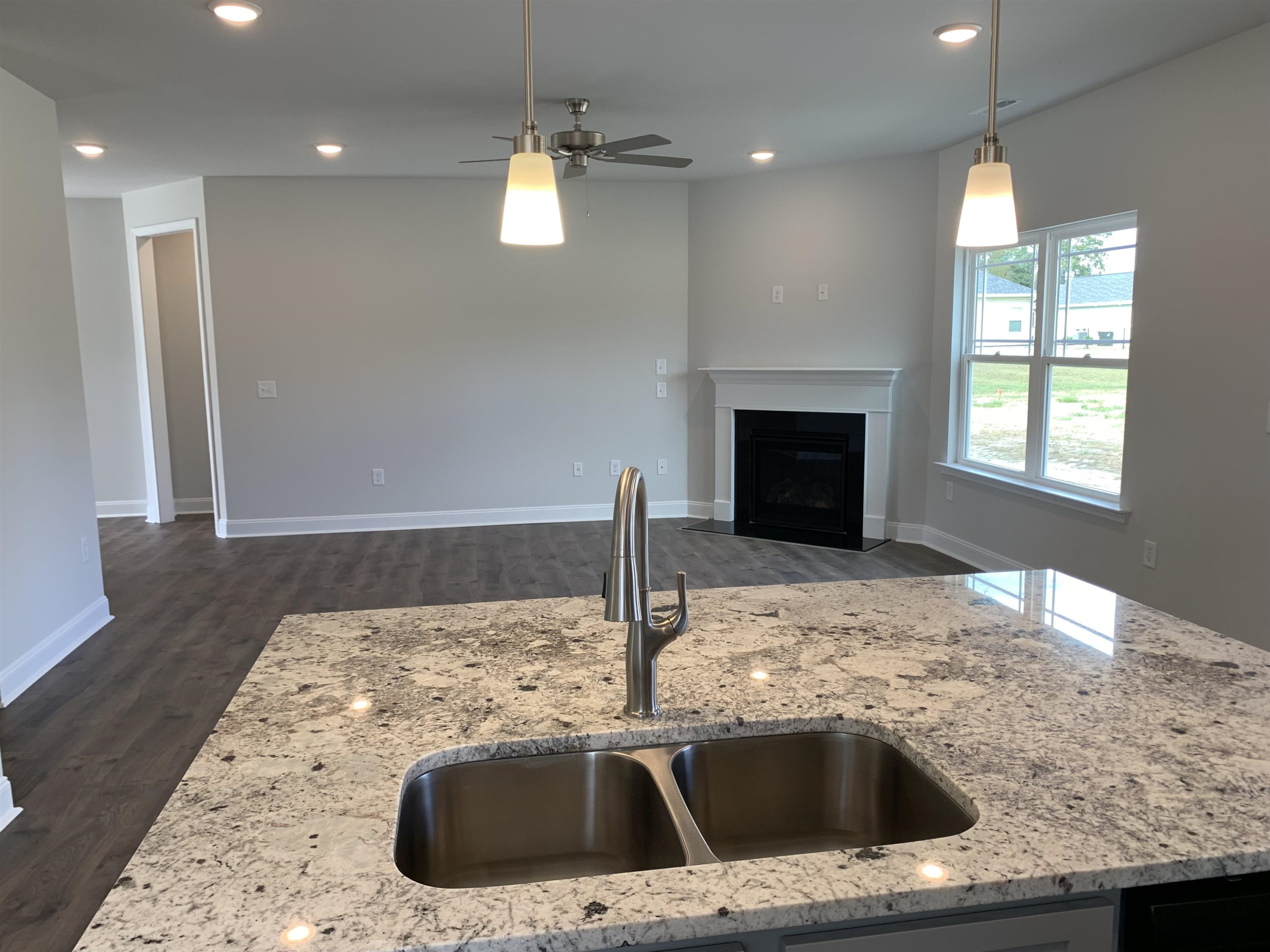 8433 Shallow Crk Trail Bailey, NC 27807 - Photo 6 of 17 a kitchen with a sink and a fireplace