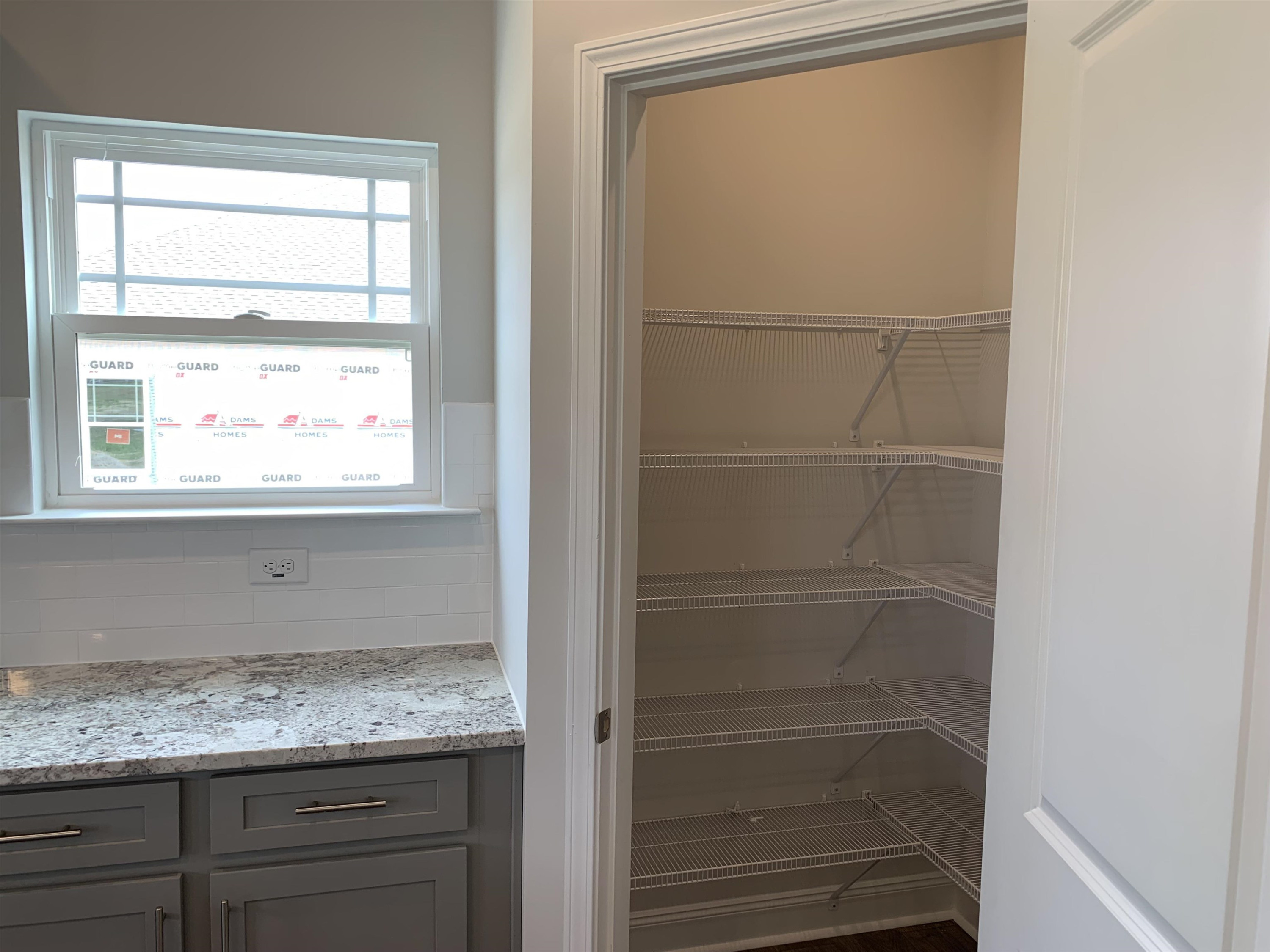 8433 Shallow Crk Trail Bailey, NC 27807 - Photo 8 of 17 a bathroom with a granite countertop sink and a window