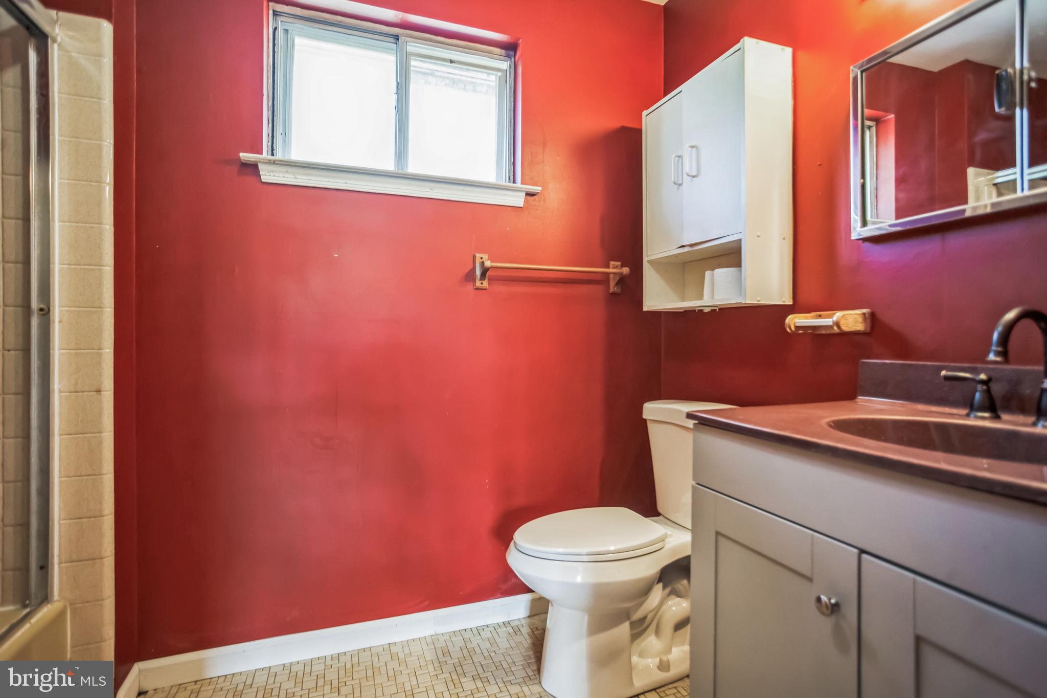 2674 Anthony Drive Colmar, PA 18915 - Photo 19 of 46 Vibrant red walls enhance this cozy bathroom.