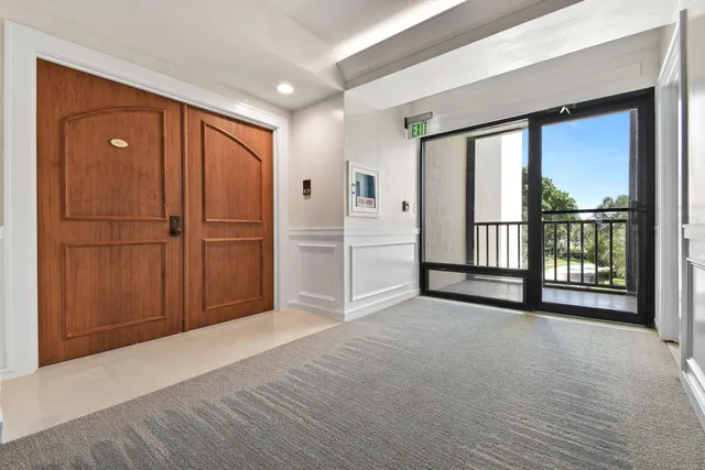 a view of an empty room with a window