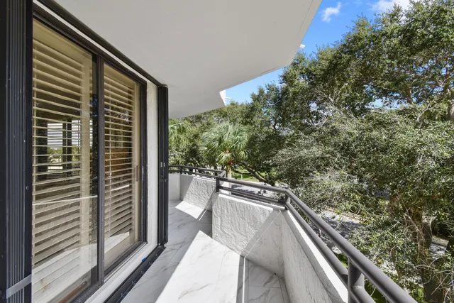 a view of balcony with furniture
