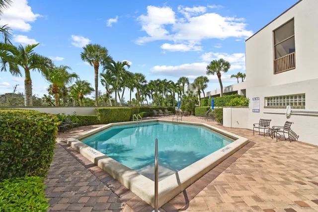 a view of a swimming pool with a patio