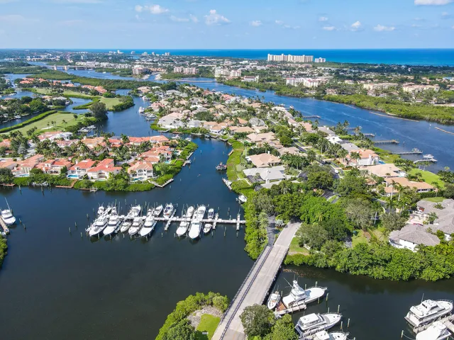 an aerial view of a house with a lake view
