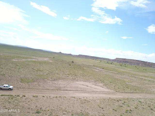 a view of an ocean beach and mountain
