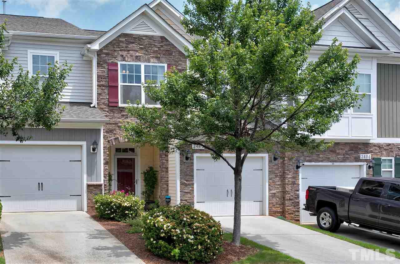 2408 Memory Ridge Drive Raleigh, NC 27606 - Photo 1 of 30 a front view of a house with parking area