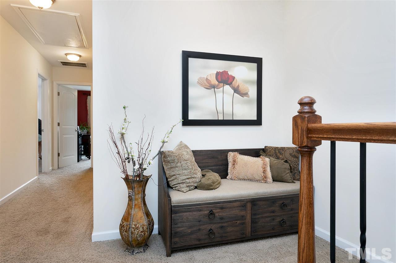 2408 Memory Ridge Drive Raleigh, NC 27606 - Photo 17 of 30 a bedroom with furniture and a painting on the wall