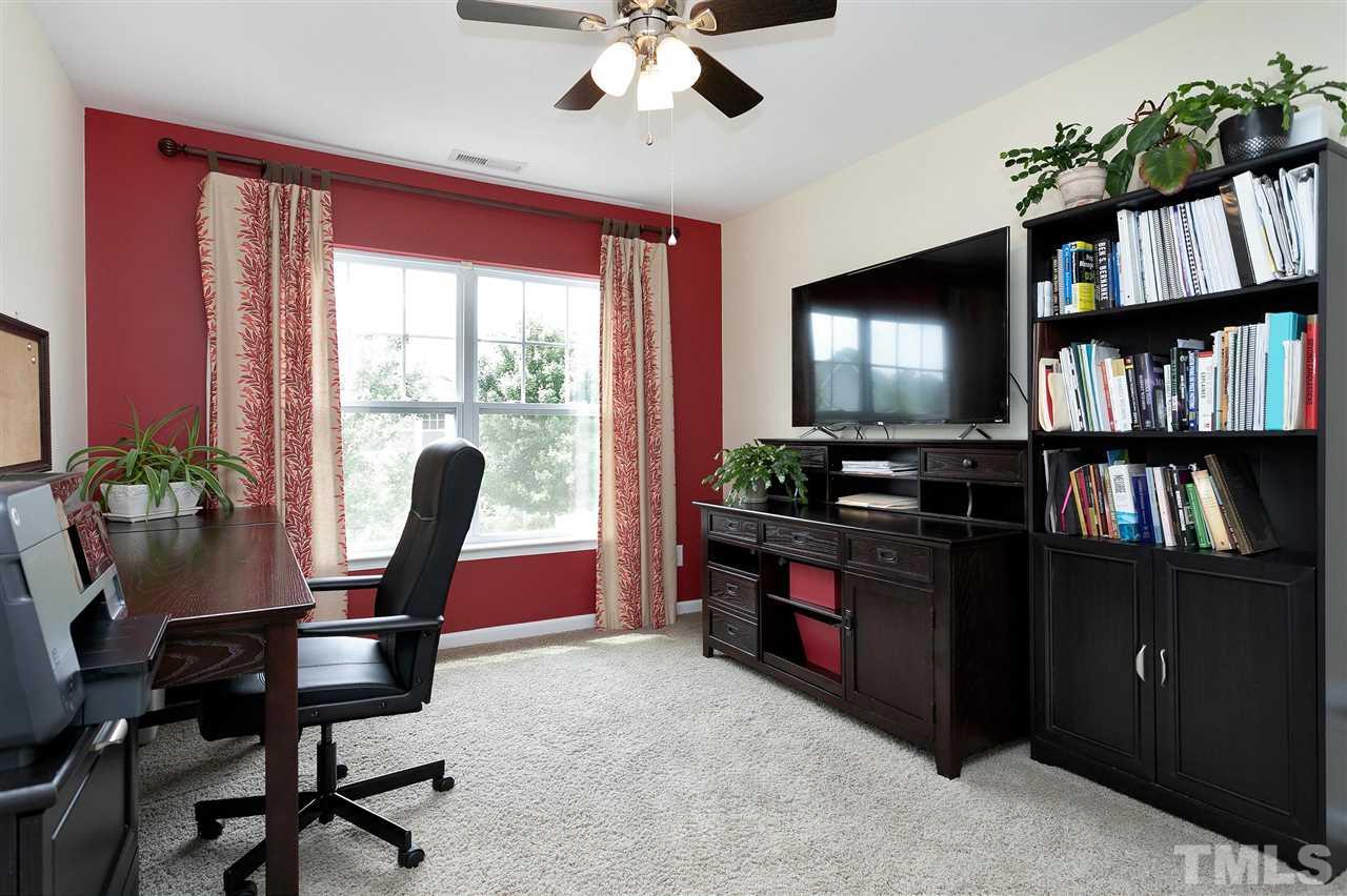 2408 Memory Ridge Drive Raleigh, NC 27606 - Photo 23 of 30 a view of a workspace with furniture and a bookshelf
