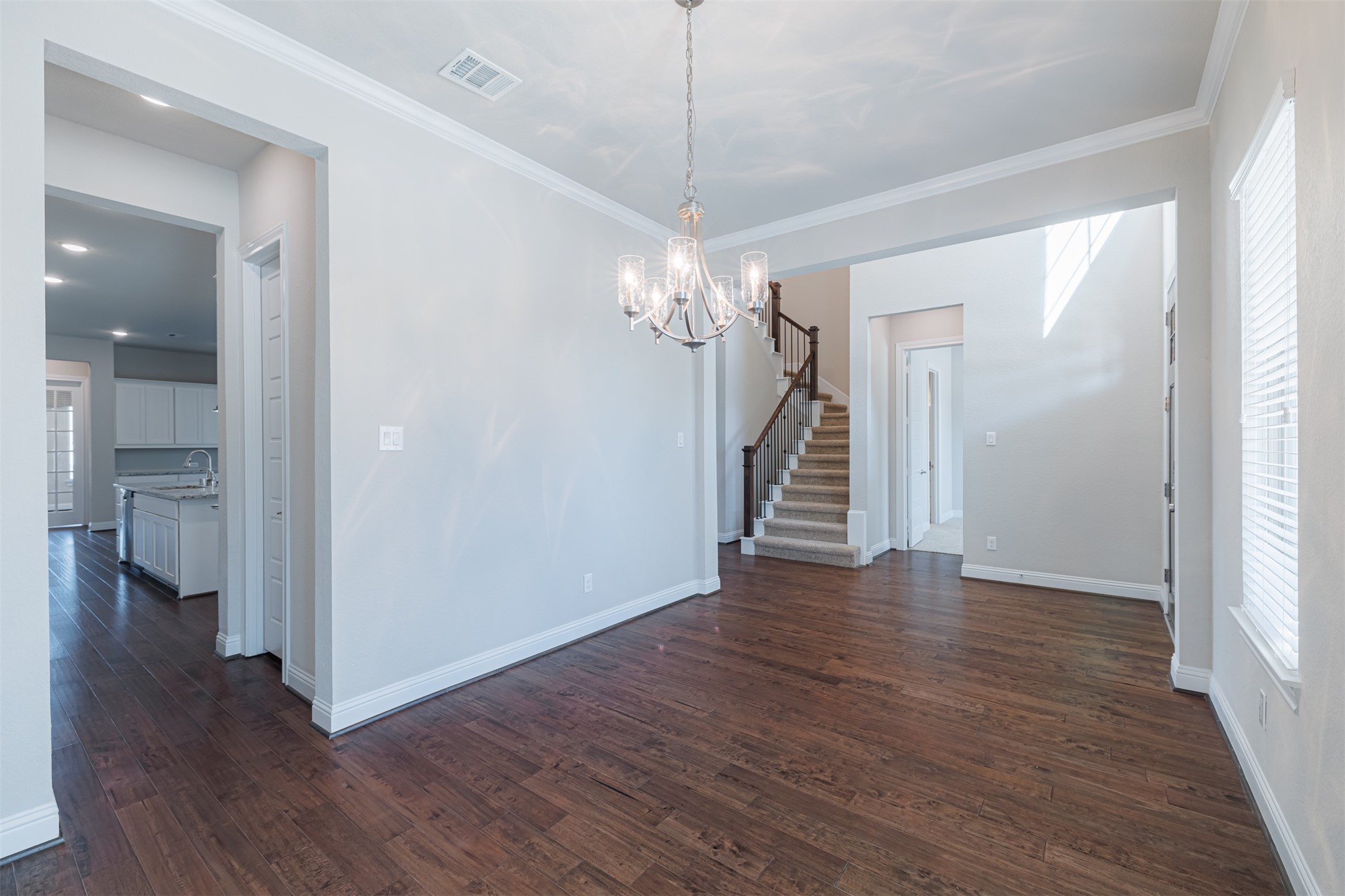 18731 Spellman Ridge Drive Tomball, TX 77377 - Photo 11 of 50 The formal dining is seamlessly connected to the kitchen through the butler's pantry.