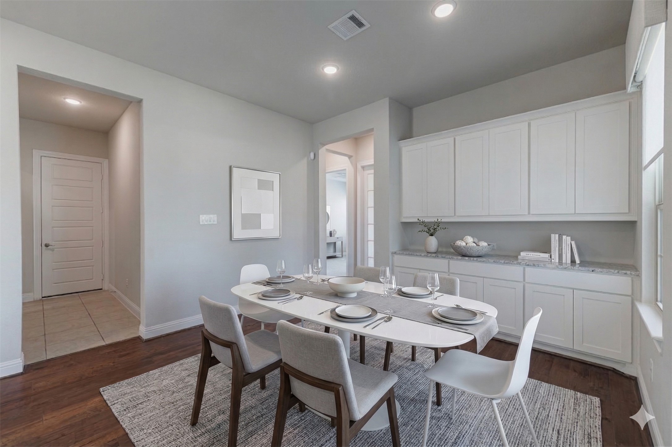 18731 Spellman Ridge Drive Tomball, TX 77377 - Photo 17 of 50 Breakfast room with wood flooring and built-in cabinetry. - Virtually Staged.