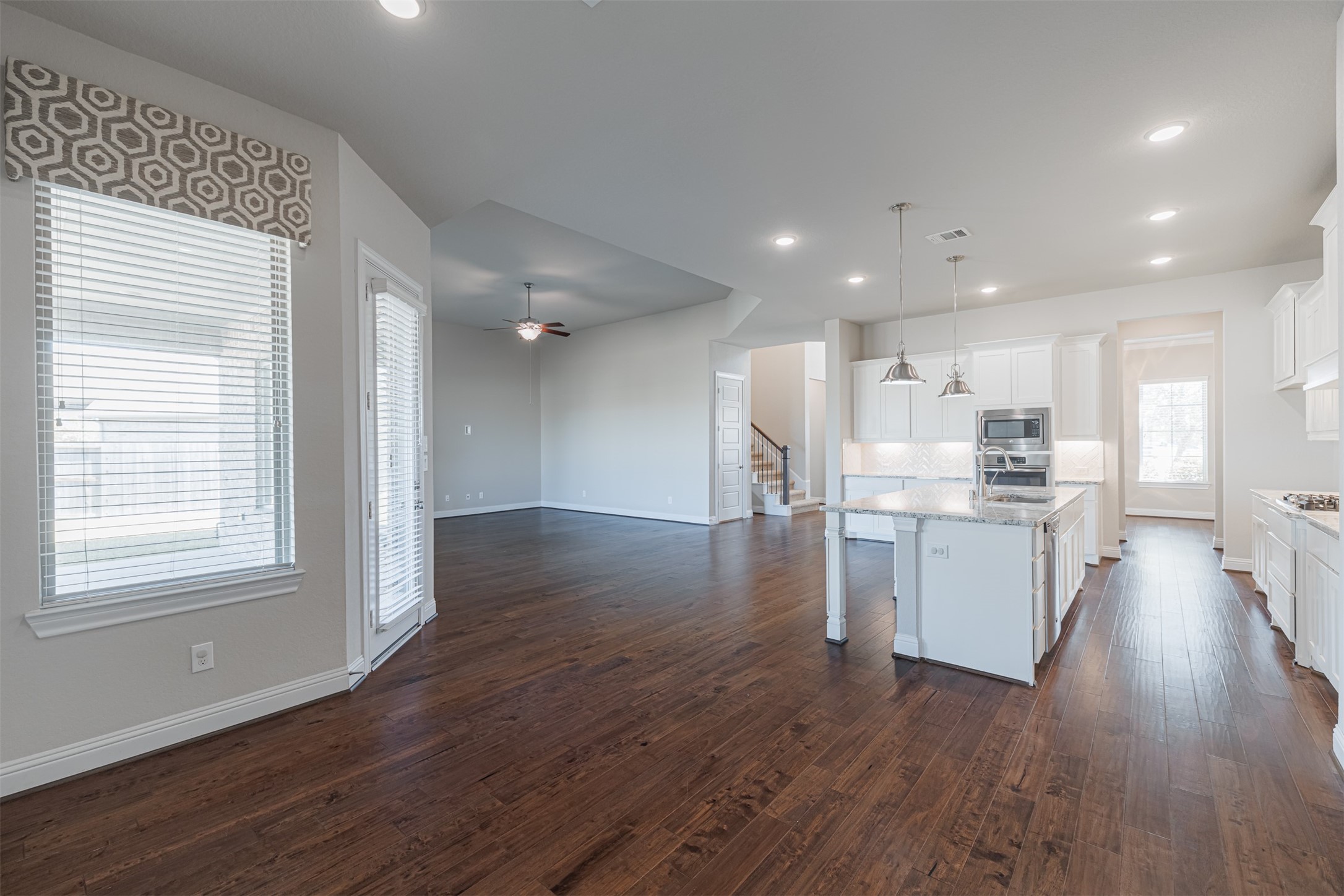 18731 Spellman Ridge Drive Tomball, TX 77377 - Photo 23 of 50 View of the kitchen and family room from the breakfast room.
