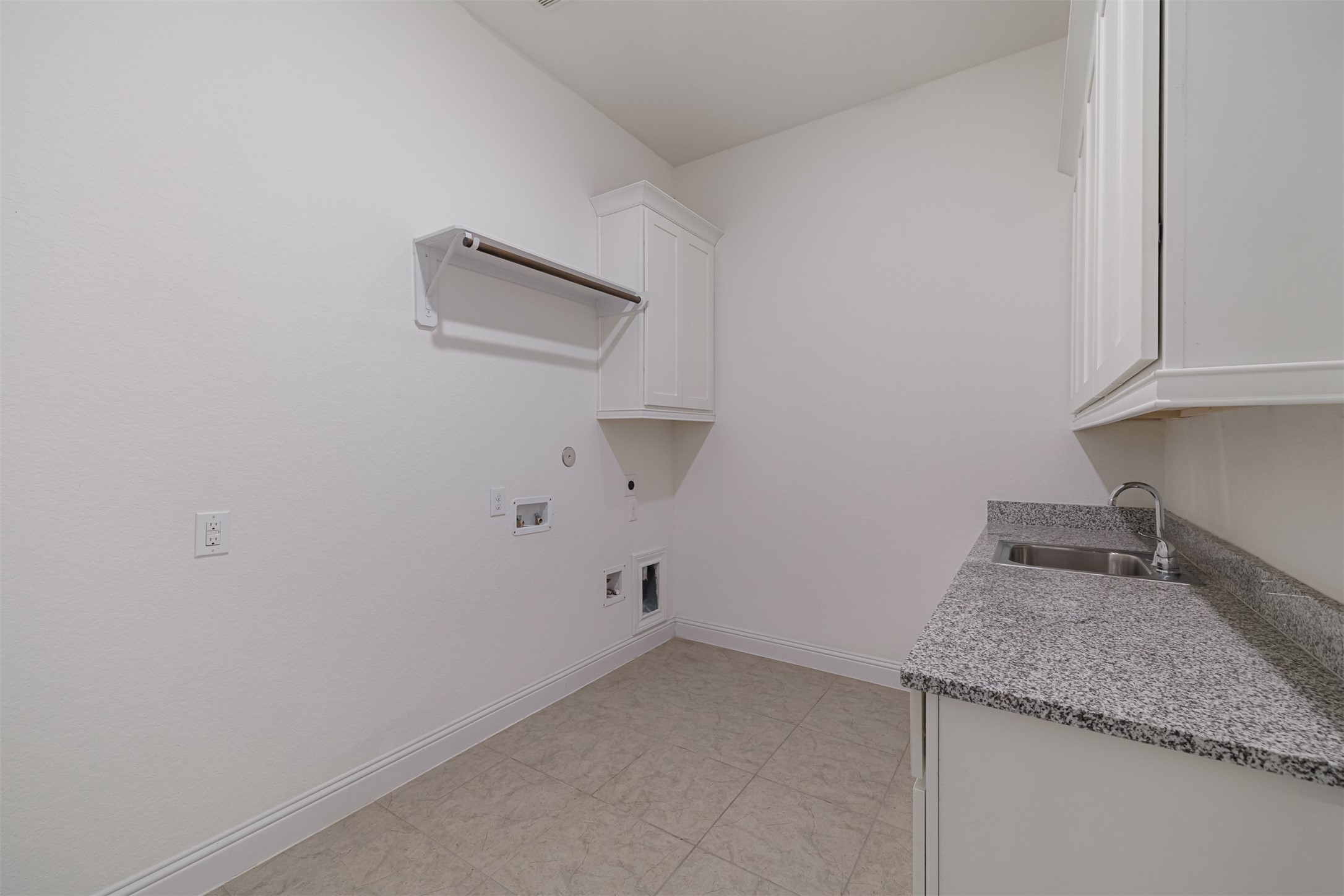 18731 Spellman Ridge Drive Tomball, TX 77377 - Photo 42 of 50 Spacious laundry room with counter, sink and cabinets.