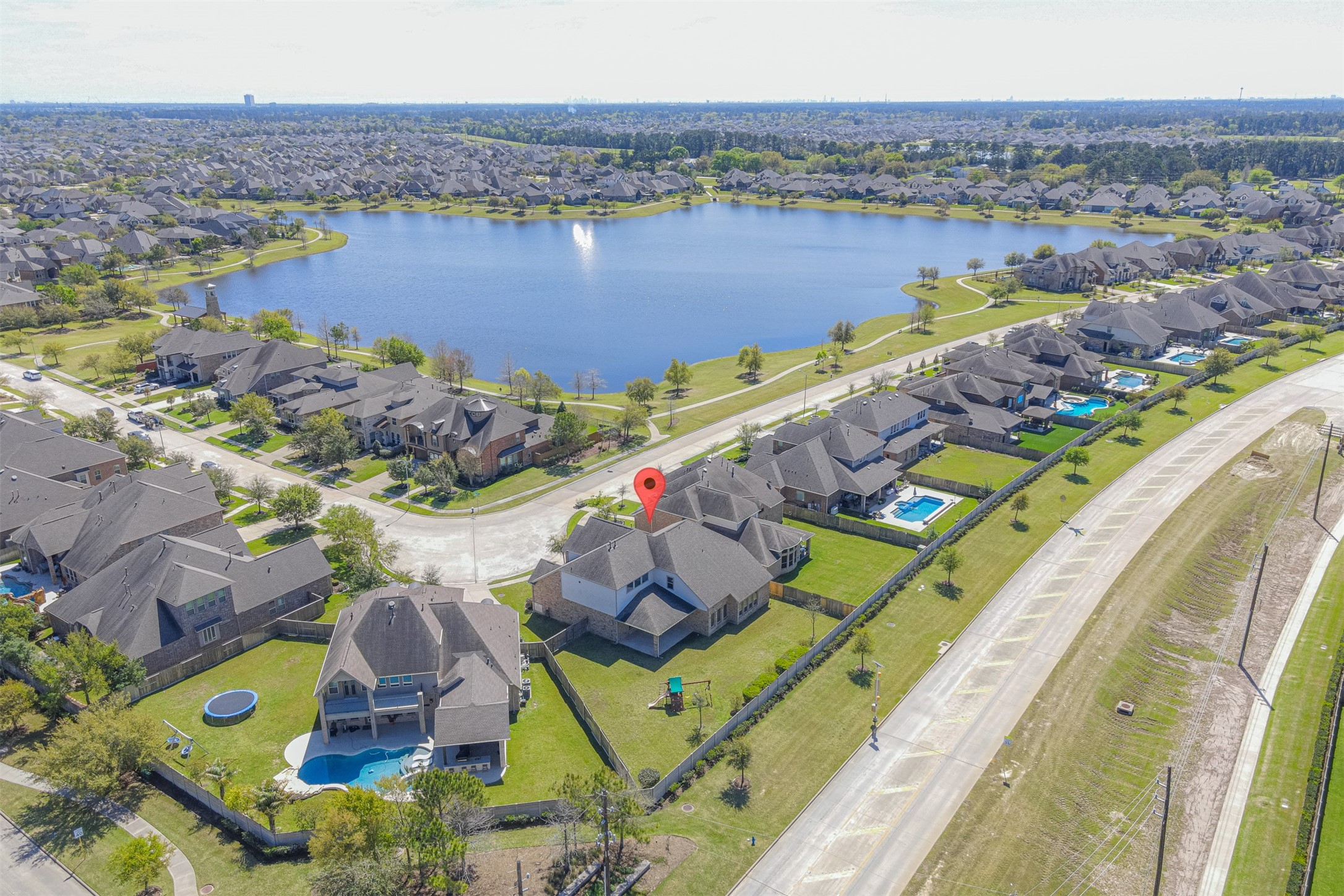 18731 Spellman Ridge Drive Tomball, TX 77377 - Photo 48 of 50 Aerial view of the house and lake.