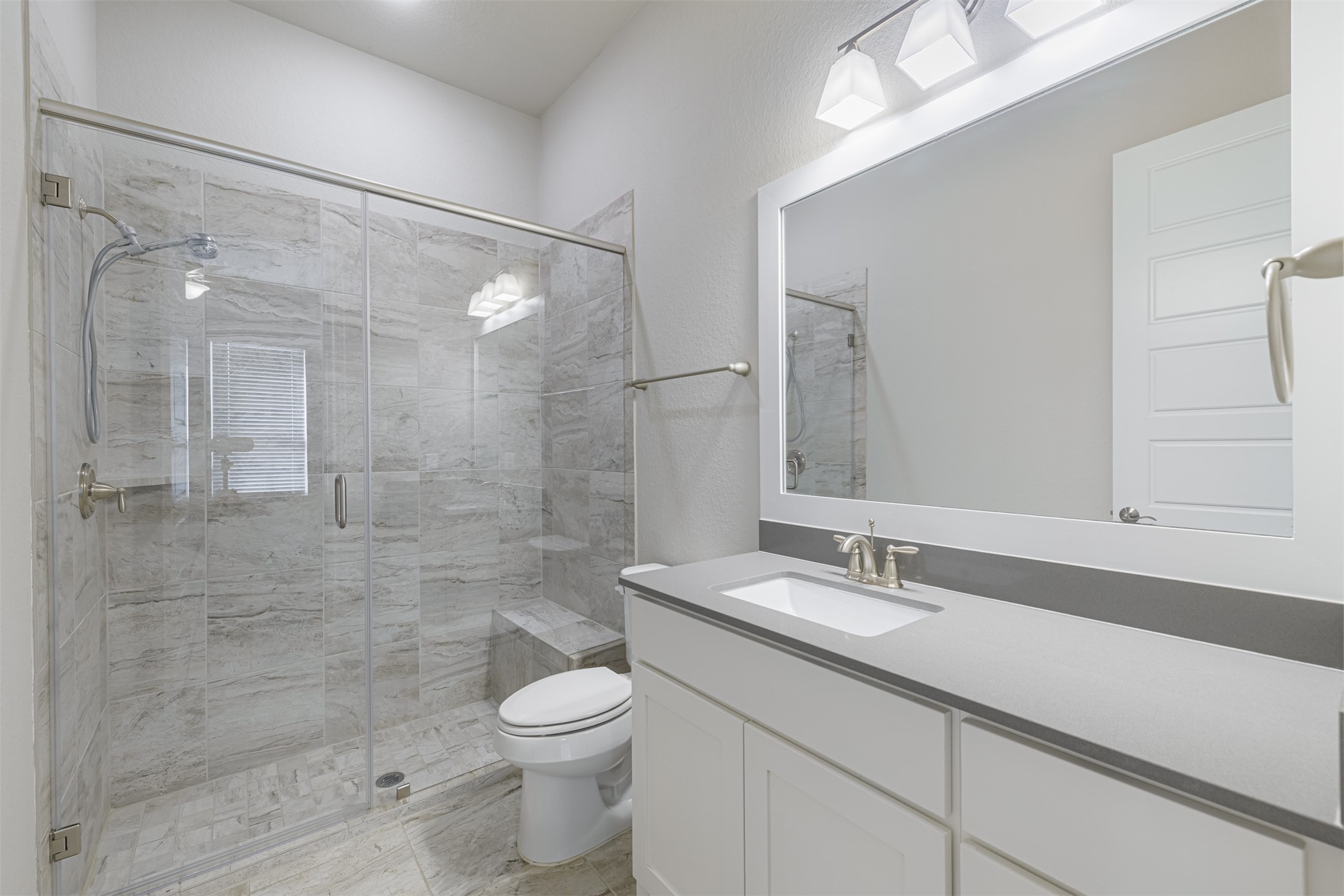 18731 Spellman Ridge Drive Tomball, TX 77377 - Photo 8 of 50 En-suite bath located off the secondary bedroom downstairs.