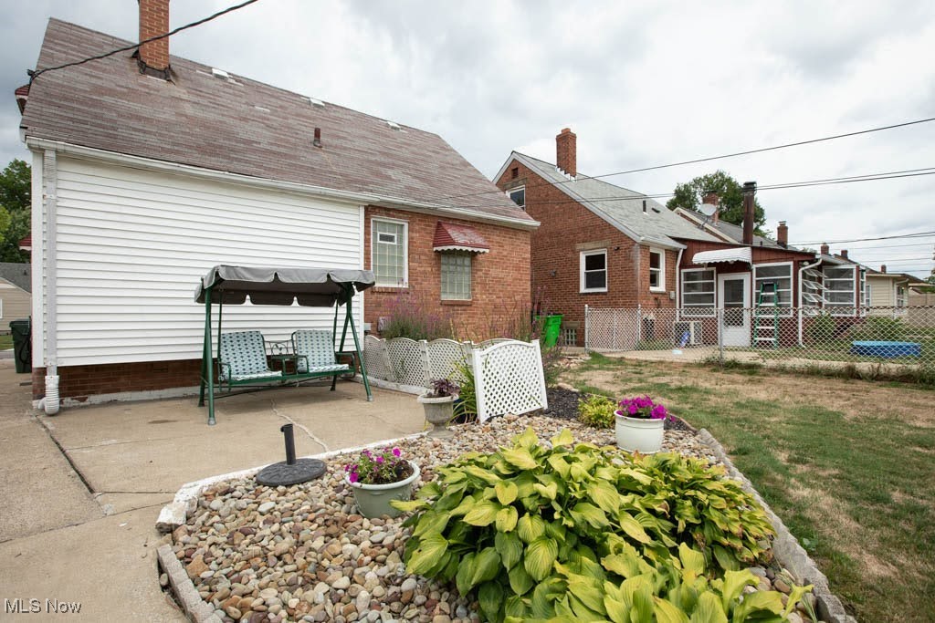 12822 Grannis Road Cleveland, OH 44125 - Photo 38 of 44 Rear view of property with a patio