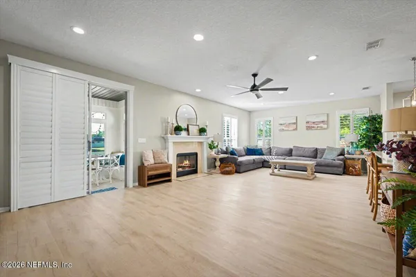 a living room with furniture and white walls