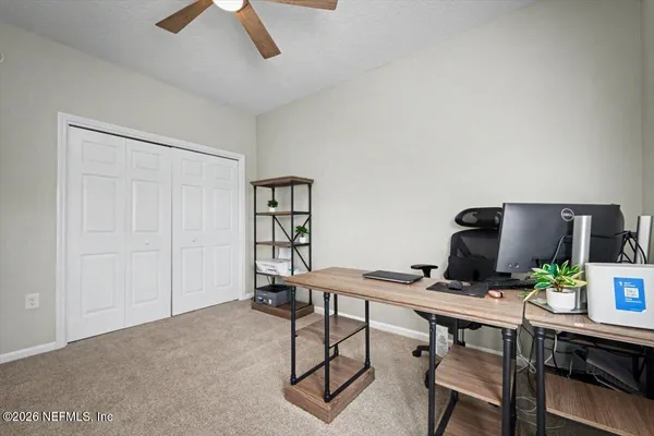 a work room with furniture and windows