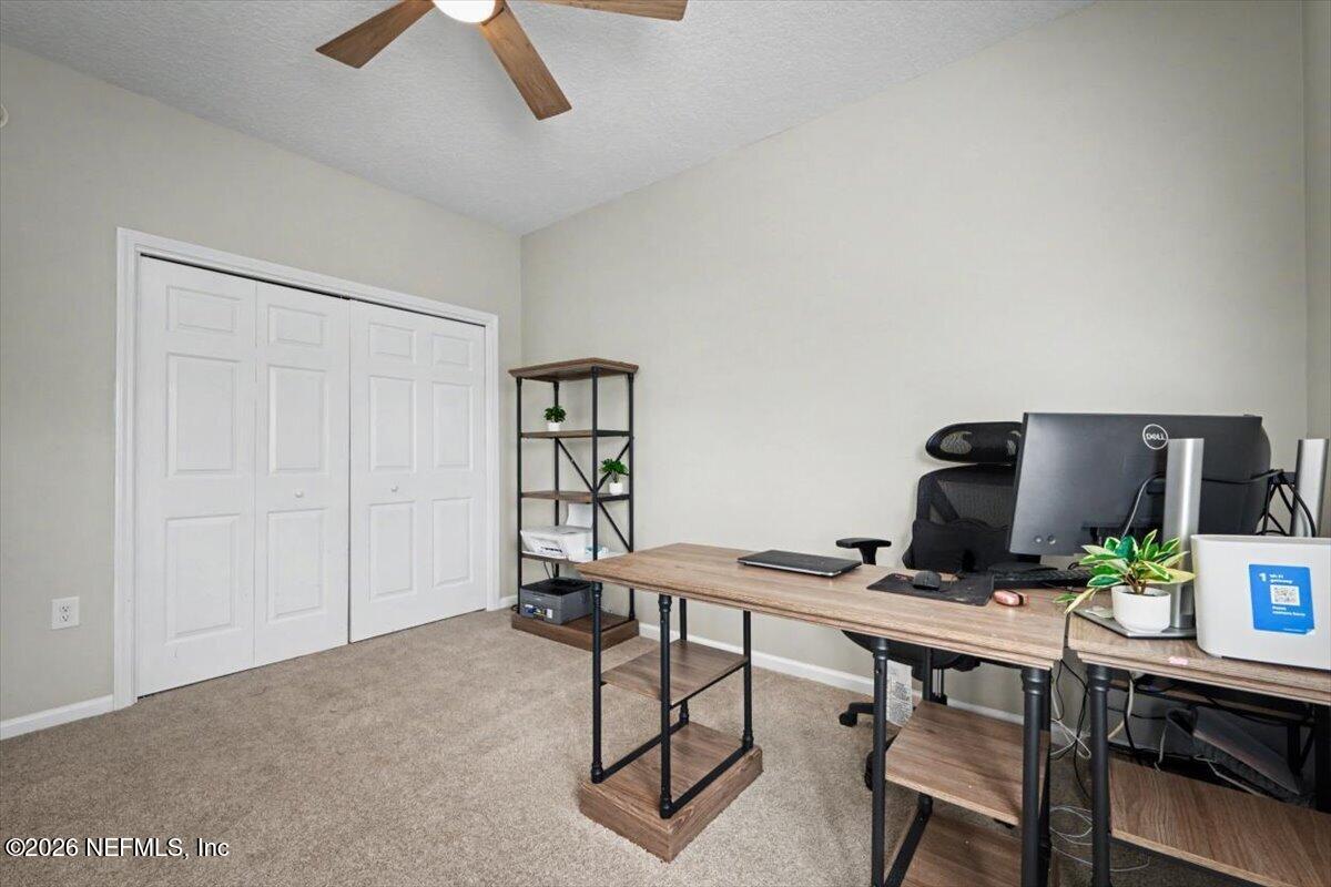 12683 Arrowleaf Lane Jacksonville, FL 32225 - Photo 26 of 52 a workspace with furniture and wooden floor