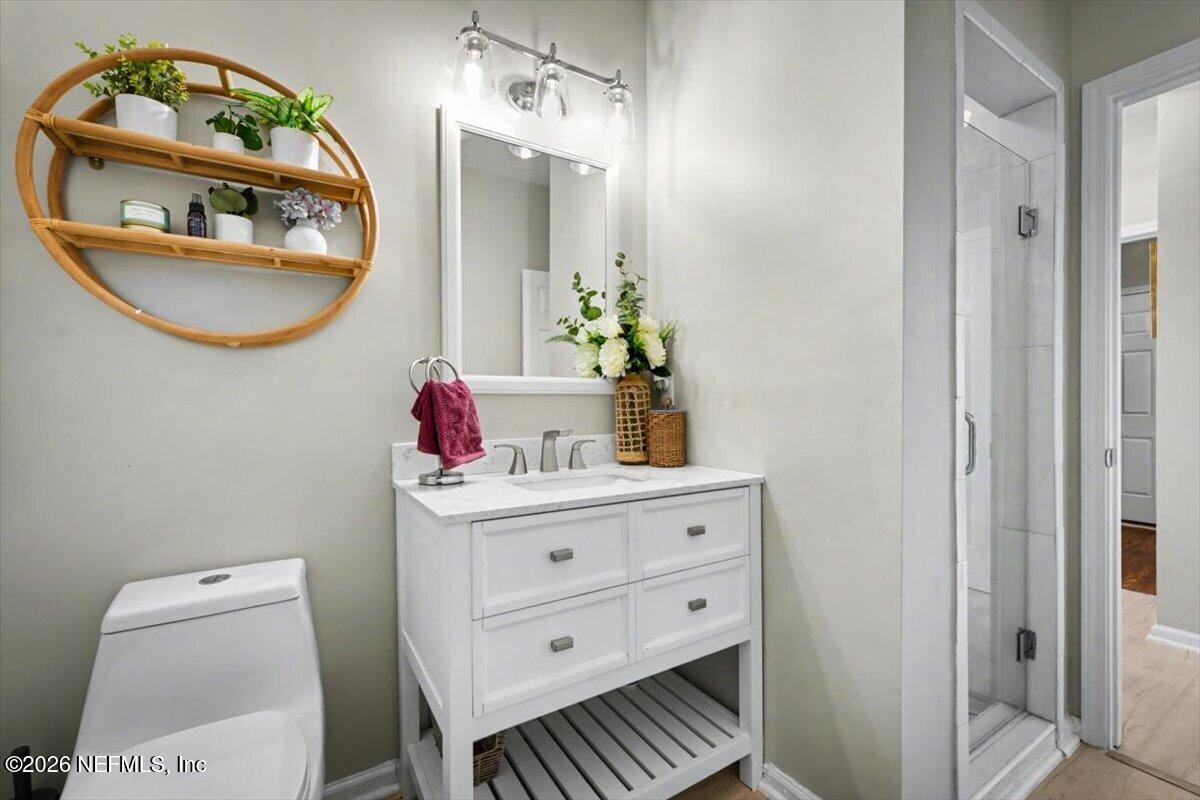 12683 Arrowleaf Lane Jacksonville, FL 32225 - Photo 28 of 52 a bathroom with a sink a mirror and a toilet