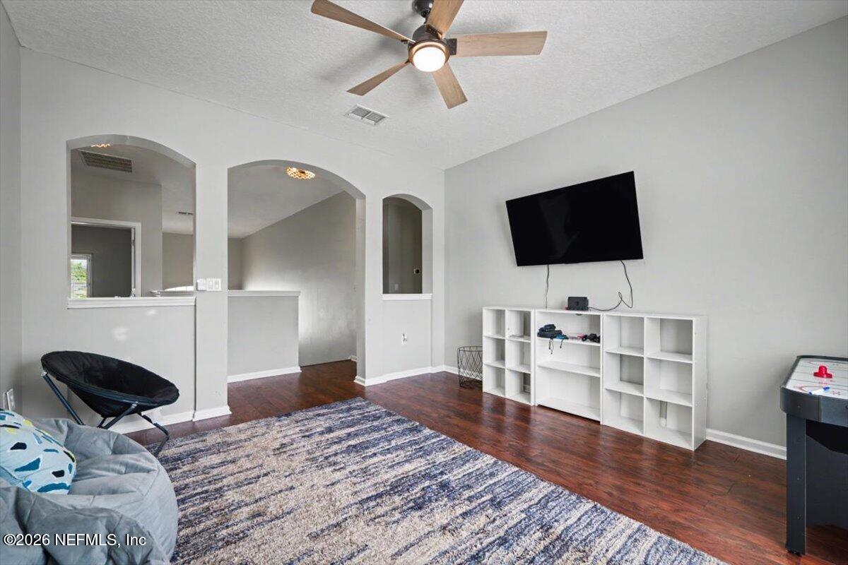 12683 Arrowleaf Lane Jacksonville, FL 32225 - Photo 31 of 52 a bedroom with bed and flat screen tv