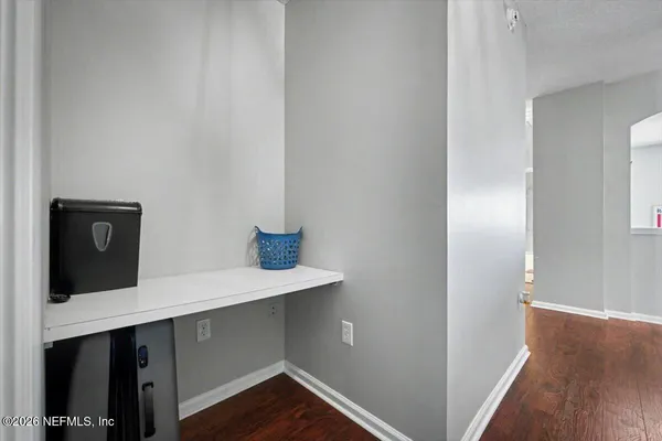 a living room with furniture ceiling fan and a window
