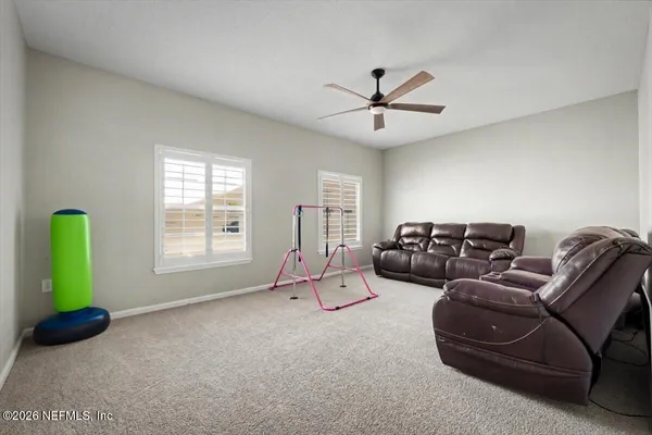 a bedroom with two beds and a chandelier
