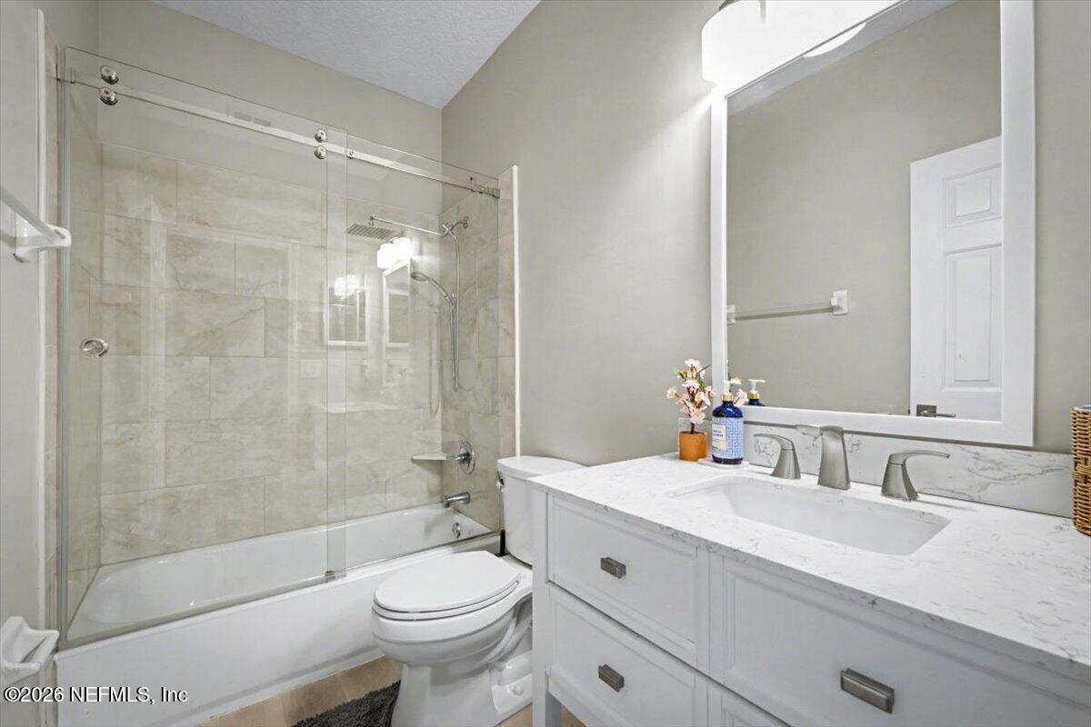 12683 Arrowleaf Lane Jacksonville, FL 32225 - Photo 36 of 52 a bathroom with a sink a toilet and shower