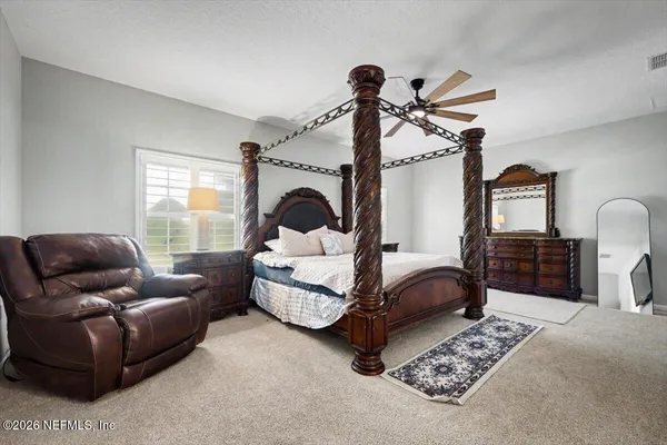 a white bath tub sitting next to a shower