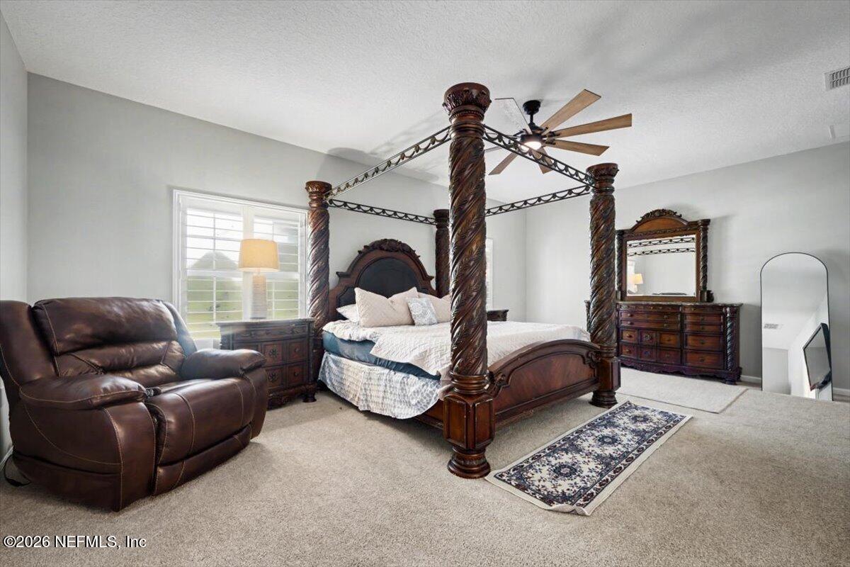 12683 Arrowleaf Lane Jacksonville, FL 32225 - Photo 43 of 52 a bedroom with furniture and a window