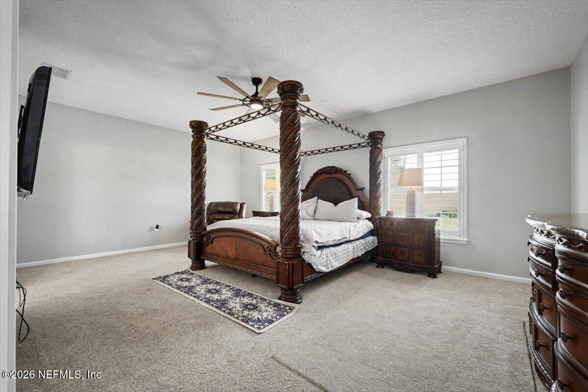 12683 Arrowleaf Lane Jacksonville, FL 32225 - Photo 44 of 52 a bedroom with furniture and a window