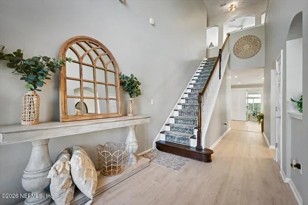 a view of a entryway door with wooden floor