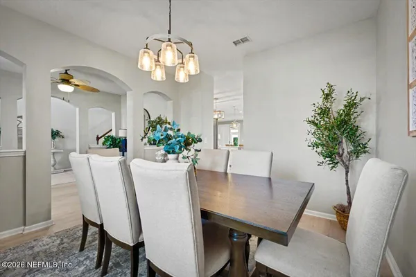 a view of a dining room with furniture window and wooden floor