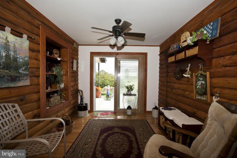 1720 East Deep Run Road Manchester, MD 21102 - Photo 17 of 30 a living room with furniture a window and a chandelier
