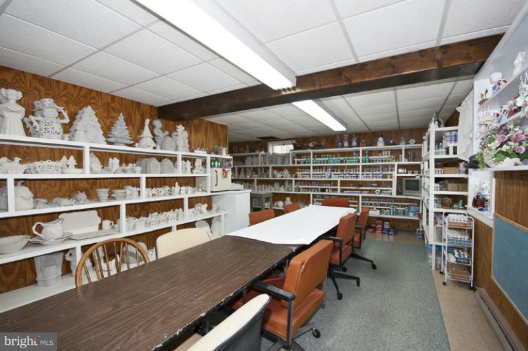 1720 East Deep Run Road Manchester, MD 21102 - Photo 24 of 30 a dining room with a wooden table and chairs