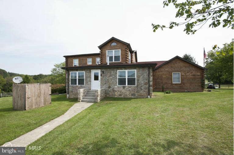 1720 East Deep Run Road Manchester, MD 21102 - Photo 29 of 30 a front view of a house with a garden and yard