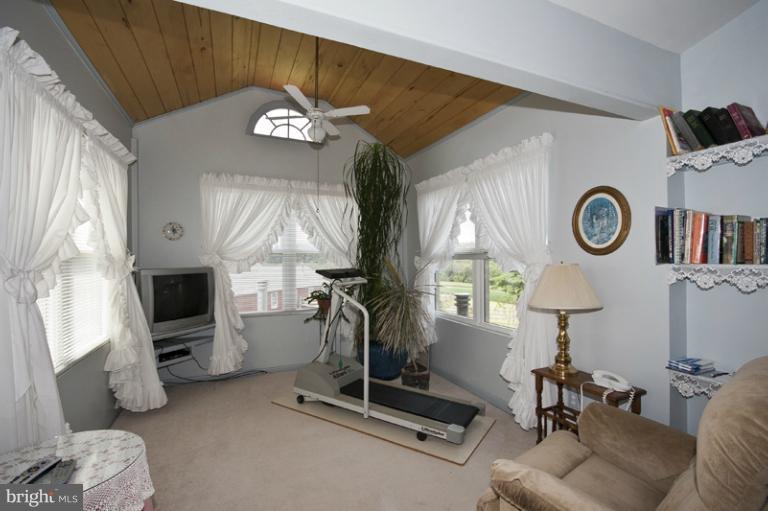 1720 East Deep Run Road Manchester, MD 21102 - Photo 6 of 30 a living room with furniture a fireplace and a window