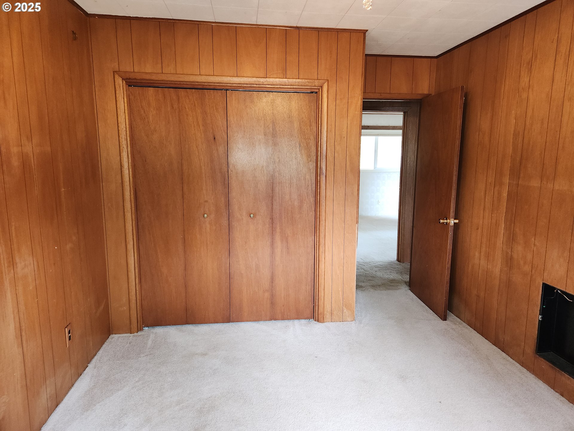 81029 Lost Creek Road Dexter, OR 97431 - Photo 18 of 46 a view of an empty room with wooden walls