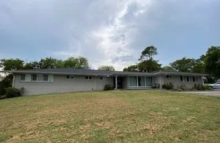 front view of a house with yard