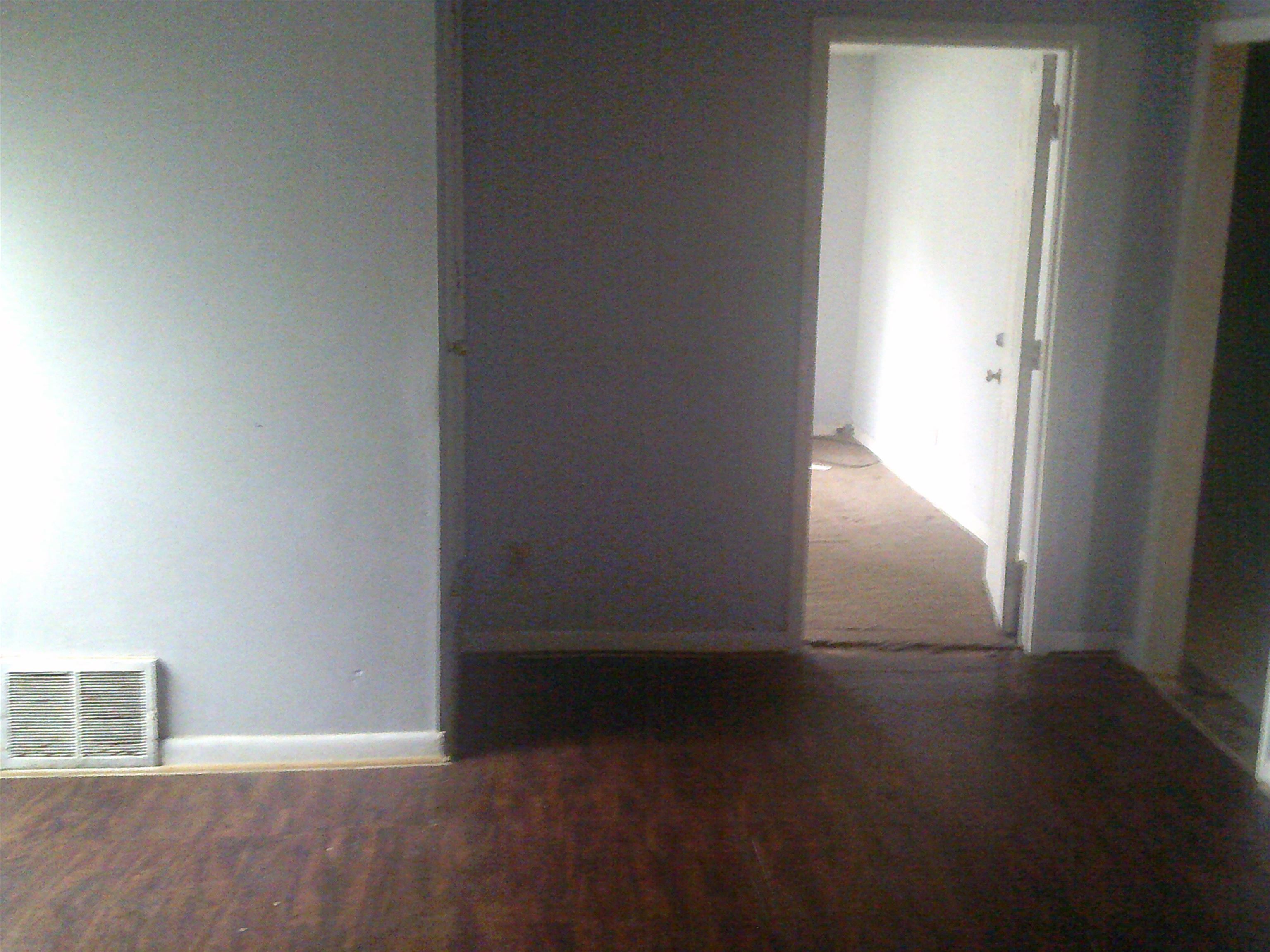 3034 Travis Road Memphis, TN 38109 - Photo 5 of 8 Interior space featuring visible vents, baseboards, and wood finished floors