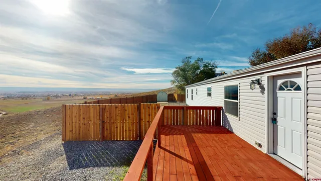a view of a balcony with wooden floor