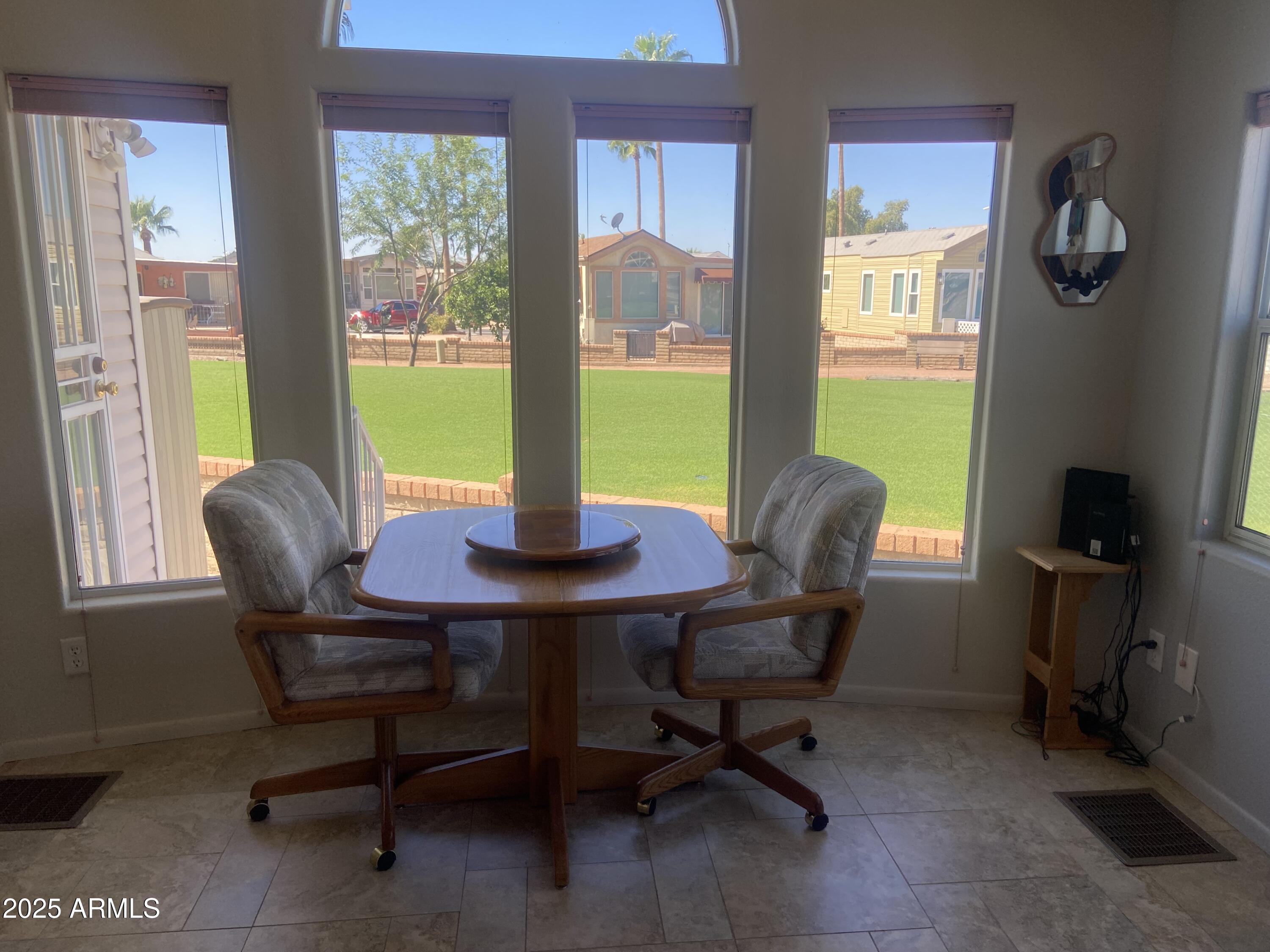 2239 West San Juan Circle Apache Junction, AZ 85119 - Photo 16 of 37 a view of a dining room with furniture and a window